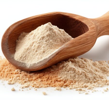Maca root powder in a wooden scoop. An organic Peruvian superfood supplement Organic maca root powder from Peru in a rustic wooden scoop. A natural adaptogen supplement known for boosting energy, vitality, and hormonal balance.